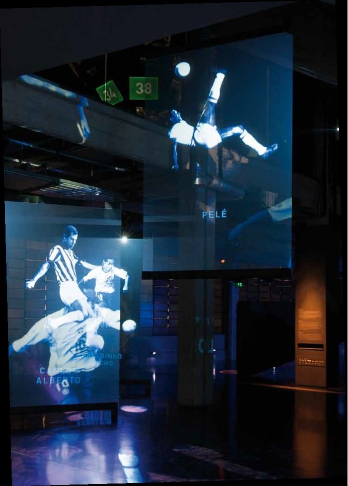 Pelé_Anjos Baroque angels room, where images of players are projected onto acrylic screens and appear to float. Pelé appears doing the bicycle move.